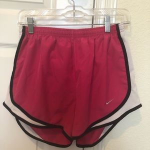 purple and pink nike shorts pair